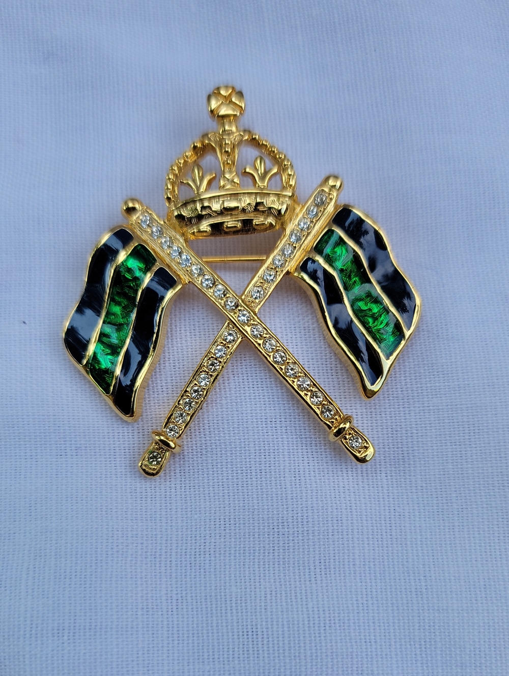Vintage Carolee Gold-Tone Crown Crossed Flags Brooch with Green and Black Enamel